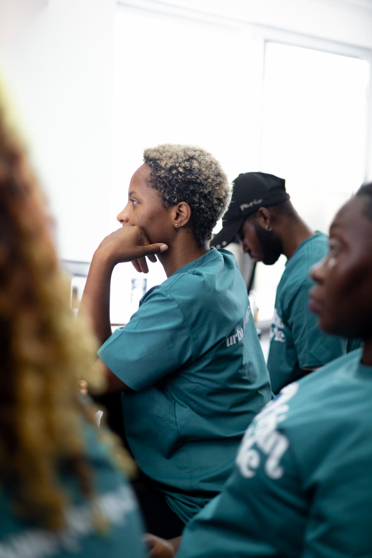 A provider listening attentively during the Urban Style training